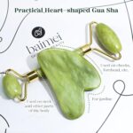 A BAIMEI IcyMe green jade roller and a matching green jade gua sha tool displayed together in an elegant box.