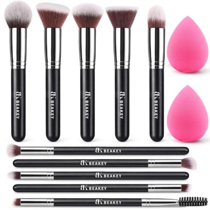 A BEAKEY 12-piece makeup brush set featuring 10 black and silver brushes and 2 blending sponges laid out on a clean surface.