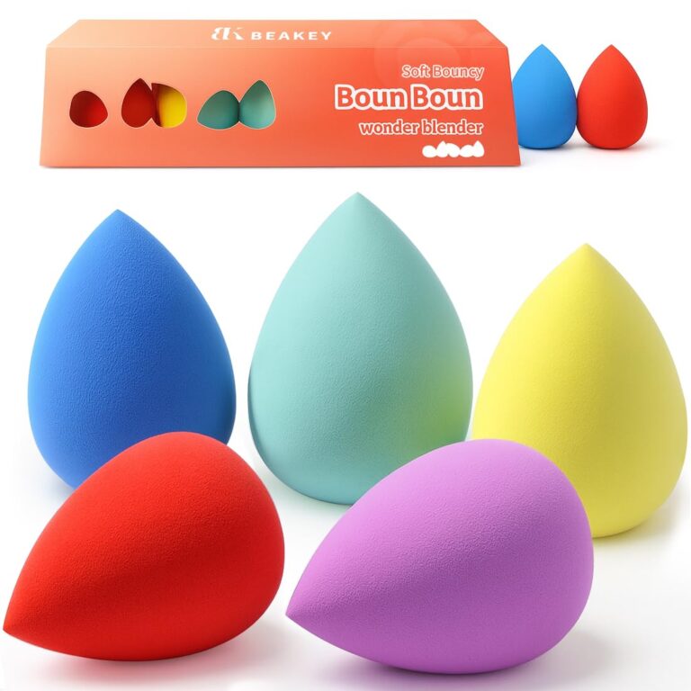 Five multi-colored BEAKEY makeup sponges in a teardrop shape, posed on a clean surface, ready for makeup application.