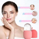 Close-up of the pink striped Joyeee silicone ice facial roller, ready for use on skin.