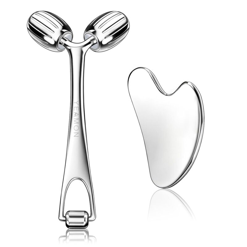 Silver Yeamon stainless steel dual-head facial roller and a matching gua sha tool on a clean surface.