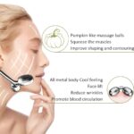 Silver Yeamon stainless steel dual-head facial roller and a matching gua sha tool on a clean surface.