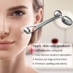 Silver Yeamon stainless steel dual-head facial roller and a matching gua sha tool on a clean surface.
