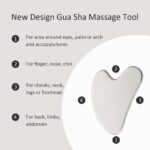 Silver Yeamon stainless steel dual-head facial roller and a matching gua sha tool on a clean surface.